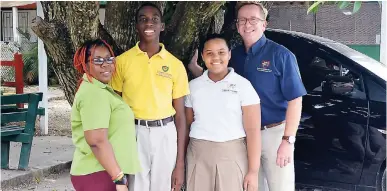  ?? CHRISTOPHE­R THOMAS PHOTO ?? From left: Carissa Perry, grade six teacher at the Montego Bay Christian Academy in St James; Jonathan Lewis, the school’s top-performing GSAT boy with a 95.2 per cent average; Rebecca Stanley, the top girl with a 99.4 per cent average; and principal...