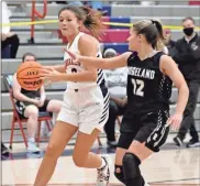  ?? Michelle Petteys, Heritage Snapshots ?? Elli Jost is defended by Ridgeland’s Macie Boren on her way to the basket. Jost had a career-high 17 points and the Heritage Lady Generals picked up a Region 7- AAAA victory early last week.