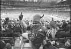  ?? PAUL SANCYA, THE ASSOCIATED PRESS ?? Captain Buffalo sure seemed to enjoy the atmosphere at Ford Field in Detroit recently.