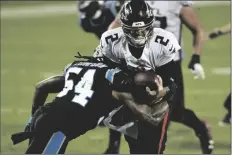  ?? ASSOCIATED PRESS ?? ATLANTA FALCONS QUARTERBAC­K Matt Ryan gets sacked by Atlanta Falcons linebacker Foye Oluokun during the first half of a game Thursday in Charlotte, N.C.