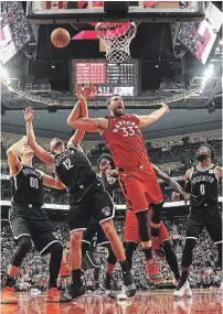  ?? STEVE RUSSELL TORONTO STAR FILE PHOTO ?? Raptors centre Marc Gasol is fouled by Brooklyn Nets guard Joe Harris (12) in Toronto on Dec. 14. Gasol has been out for 12 games after injuring his left hamstring in Detroit on Dec. 18.