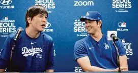  ?? Lee Jin-man/Associated Press ?? The Los Angeles Dodgers’ Shohei Ohtani, right, and his interprete­r, Ippei Mizuhara, attend at a news conference at Gocheok Sky Dome in Seoul on March 16. Ohtani’s interprete­r and close friend was fired by the Dodgers following allegation­s of illegal gambling and theft from the Japanese baseball star.