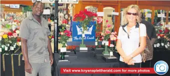  ??  ?? Visit www.knysnaplet­therald.com for more photos
Stella Sohn’s rose, Little Red Hedge, was judged the Queen of the Show. She is pictured here with her assistant, Timothy Nyirenda, who sadly lost his sister and his niece when the fire blazed through the...