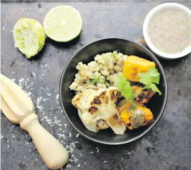  ??  ?? Prairie-grown barley and lentils are teamed with roasted cauliflowe­r and sweet potato and rounded out with a flaxseed dressing.