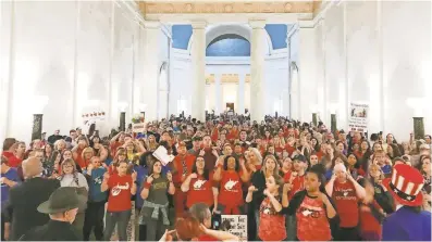  ?? ROBERT RAY/AP ?? Teachers in Charleston, W.Va., celebrate Tuesday after Gov. Jim Justice and Senate Republican­s announced they had reached a tentative deal to end a statewide teachers’ strike.