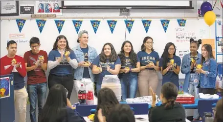  ?? Allen J. Schaben Los Angeles Times ?? SENIORS at Downey’s Warren High School are celebrated by fellow students Wednesday at an IDEAS meeting.