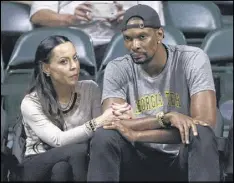  ?? LYNNE SLADKY / AP ?? Heat forward and former Jackets star Chris Bosh and his wife, Adrienne, attended a recent Georgia Tech game against Miami in Coral Gables, Fla.