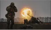  ?? LIBKOS — THE ASSOCIATED PRESS ?? Ukrainian soldiers fire a Pion artillery system at Russian positions near Bakhmut, Donetsk region, Ukraine, on Friday.