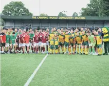  ?? ?? The teams line up ready for the match – which ended in a 7-7 draw