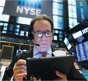  ?? RICHARD DREW / THE ASSOCIATED PRESS ?? Trader Sal Suarino works on the floor of the New York Stock Exchange on Friday. Many investors believe the market is more predictabl­e than it actually is, writes Tom Bradley.