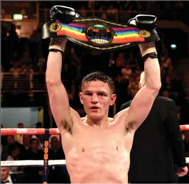  ?? ?? Willie Limond celebrates becoming Commonweal­th and British light welterweig­ht champion after defeating England’s Curtis Woodhouse at Glasgow’s Braehead Arena in 2014