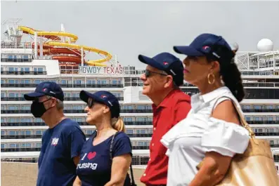  ?? Photos by Marie D. De Jesús / Staff photograph­er ?? Carnival Cruise Vista has a sign that reads “Howdy Texas” a day after it arrived in Galveston. In the foreground, several members of the cruise industry attend a Carnival event aimed at getting federal travel restrictio­ns lifted.