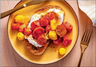  ?? PHOTO FOR THE WASHINGTON POST BY SCOTT SUCHMAN ?? Roasted Cherry Tomato Confit on toast with ricotta cheese