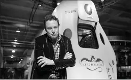  ?? Associated Press ?? ■ Elon Musk, CEO and CTO of SpaceX, listens to a question on May 29. 2014, during a news conference in front of the Dragon V2 spacecraft at SpaceX headquarte­rs in Hawthorne, Calif.