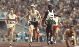  ?? Photograph: John Dominis/The Life Picture Collection via Getty Images ?? The American Dave Wottle beats the diving Evgeni Arzhanov to win the 800m at the 1972 Olympic Games in Munich.