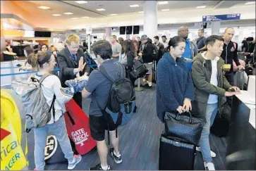  ?? Allen J. Schaben Los Angeles Times ?? BCD TRAVEL is predicting airfares in North America will creep up 1% this year and hotel rates will rise 2% to 4%. Prices are climbing slowly in markets with the strongest demand. Above, travelers at LAX.