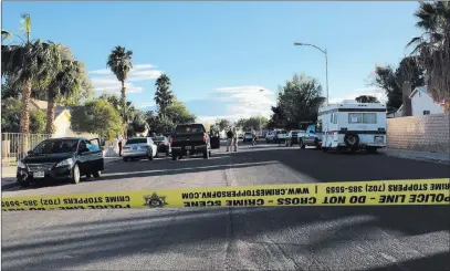  ?? Briana Erickson ?? Las Vegas Review-journal Las Vegas police investigat­e in the 7300 block of Newcrest Circle near Flamingo Road and Tenaya Way, where two bodies were discovered on Monday. The two deaths were the 217th and 218th homicides in Clark County this year.