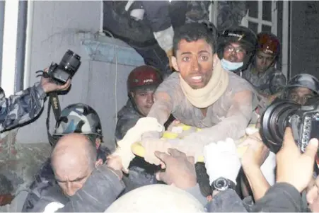  ??  ?? Nepalese earthquake survivor Rishi Khanal suffered a leg injury after being trapped under the debris of a damaged building in Kathmandu.