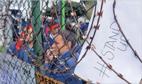  ?? PICTURE: DAVID RITCHIE ?? ROOTED: Pupils protest against alleged discrimina­tion and racism at Sans Souci Girls’ High School in Newlands, Cape Town. We have learnt this year that racism is not something that happened in the past, and even if it did, and ended with the dawn of...