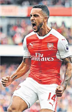  ??  ?? Sharp shooter: Theo Walcott celebrates after scoring his and Arsenal’s second goal