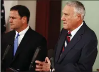  ?? AP/ROSS D. FRANKLIN ?? Former GOP Sen. John Kyl (right) and Arizona Gov. Doug Ducey hold a news conference Tuesday in Phoenix at which Ducey announced that Kyl would fill the U.S. Senate seat left vacant by the death of John McCain at least until the end of the year.