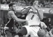  ?? AP/TONY DEJAK ?? Toronto guard Cory Joseph (left) strips the ball from Cleveland forward Channing Frye during Game 2 of their NBA Eastern Conference semifinal series Wednesday. The Raptors forced 16 turnovers, but the Cavaliers got 39 points from LeBron James to pull...