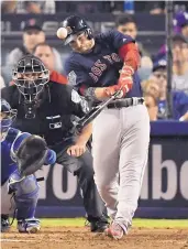  ?? MARK J. TERRILL/ASSOCIATED PRESS ?? Boston’s Steve Pearce follows through on a gametying home run in the eighth inning of Saturday’s Game 4 of the World Series.