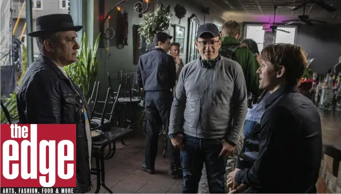  ??  ?? BEHIND THE SCENES: Joe Russo, Anthony Russo and Tom Holland discuss a scene in ‘Cherry,’ premiering Friday on Apple TV+. apple tV+