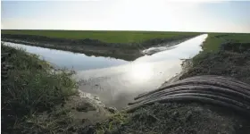  ?? Rich Pedroncell­i / Associated Press 2016 ?? Some of the water from proposed delta tunnels would flow to farms such as this one near Lemoore in the San Joaquin Valley.