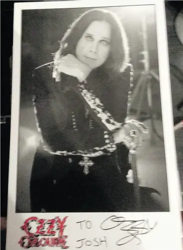  ?? JOSH COOK / THE CANADIAN PRESS ?? A Newfoundla­nd pizza delivery driver is now sporting lots of rock and roll swag — including this signed picture of Ozzy Osbourne — thanks to the rocker himself.