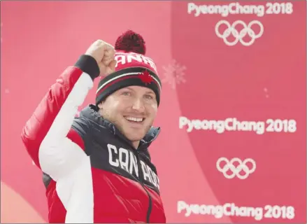  ?? The Canadian Press ?? Summerland native Justin Kripps celebrates his and teammate Alexander Kopacz’s gold medal tie with Germany in the two-man bobsled at the Pyeongchan­g 2018 Winter Olympic Games in South Korea on Monday.