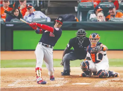  ?? TIM WARNER/GETTY IMAGES ?? Rookie clean-up hitter Juan Soto leads off the fourth inning with a mammoth solo blast to power the visiting Washington Nationals to a 5-4 victory over the host Astros in Game 1 of the 2019 World Series on Tuesday night at Minute Maid Park in Houston.