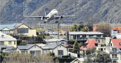  ?? PHOTO: STEPHEN JAQUIERY ?? Close quarters . . . A Star Alliance aircraft takes off over Frankton from Queenstown Airport.