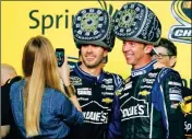  ?? ASSOCIATED PRESS ?? IN THIS NOV. 17, 2013, file photo, Chandra Johnson takes photos of her husband, Jimmie Johnson (center) and his crew chief, Chad Knaus, after Jimmie won his sixth NASCAR Sprint Cup Series championsh­ip in Homestead, Fla.