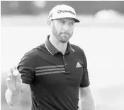  ?? SAM GREENWOOD/GETTY IMAGES ?? Dustin Johnson waves to the crowd after a birdie Sunday at the Sentry Tournament of Champions in Hawaii.