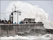  ?? BEN BIRCHALL/AP ?? Rough seas pound against the harbor wall at Porthcawl in Wales as storm Dennis sweeps the country Saturday.