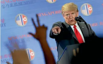  ?? AP ?? US President Donald Trump answers questions about the summit with North Korea leader Kim Jong Un during a press conference at the Capella resort in Singapore on Tuesday.