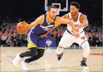  ?? BRAD PENNER USA TODAY ?? Warriors guard Stephen Curry drives against Knicks guard Derrick Rose in the second quarter of Golden State’s 112-105 win Sunday at Madison Square Garden. Curry scored 31 points.