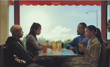  ?? A24 ?? KELVIN HARRISON JR., left, Taylor Russell, Sterling K. Brown and Renée Elise Goldsberry in “Waves.”