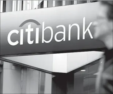  ?? Emmanuel Dunand AFP/Getty Images ?? CITIGROUP IS the No. 2 U.S. card-issuing bank by loan volume. The average rate on interest-bearing cards topped 17% in May, a 25-year high, according to the Federal Reserve, which cut interest rates last week.