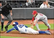  ?? HYOSUB SHIN/HYOSUB.SHIN@AJC.COM ?? Braves center fielder Cristian Pache (25), sliding into third base against the Phillies last week, was placed on the 10-day injured list Wednesday with a strained left groin. Ender Inciarte replaced him during Tuesday’s game and started in center Wednesday.