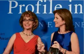  ?? DINA RUDICK/GLOBE STAFF/2013 ?? 2009: Gabrielle Giffords (left) was presented a Profile in Courage honor by Caroline Kennedy for work on gun control.
