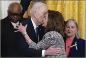  ?? THE ASSOCIATED PRESS ?? President Joe Biden kisses House Speaker Nancy Pelosi during an Affordable Care Act event Tuesday, A tweet Thursday said Pelosi had tested positive for COVID-19.