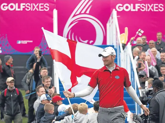  ?? Picture: PA. ?? England’s Chris Wood flies the flag on the first tee during the weekend’s inaugural GolfSixes.