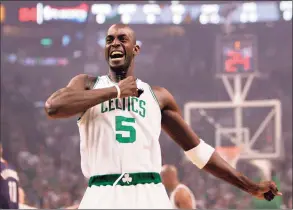  ?? Charles Krupa / Associated Press ?? Boston Celtics forward Kevin Garnett pounds his chest as he heads to the floor before the Celtics faced the Cleveland Cavaliers in Game 2 of an Eastern Conference semifinal series in Boston in 2008.