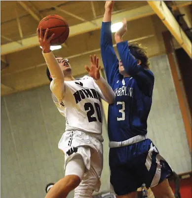  ?? Photo by Ernest A. Brown ?? Woonsocket wing Jacob Bissonnett­e, who scored 12 points and hit a pair of 3-pointers, attempts to drive past a Cumberland defender during the Novans’ 59-56 Division I home defeat to the Clippers Friday night.
