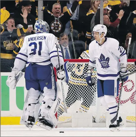  ?? ASSOCIATED PRESS ?? Frederik Andersen and Nikita Zaitsev look at each other following a Bruins goal during Saturday’s Game 2 loss in Boston.