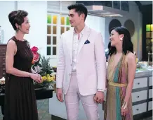  ??  ?? Michelle Yeoh, left, Henry Golding and Constance Wu star in Crazy Rich Asians — a movie with a cast which was assembled in a sweeping worldwide search that included multiple countries.