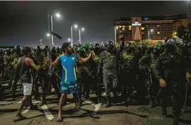  ?? RAFIQ MAQBOOL/AP ?? A protester shouts slogans Friday as army soldiers arrive to clear the site of a protest camp outside the Presidenti­al Secretaria­t in Colombo, Sri Lanka.