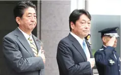  ??  ?? Abe (left) and Onodera review an honour guard during Abe’s visit to the Defence Ministry to meet with senior officials in Tokyo. — AFP photo